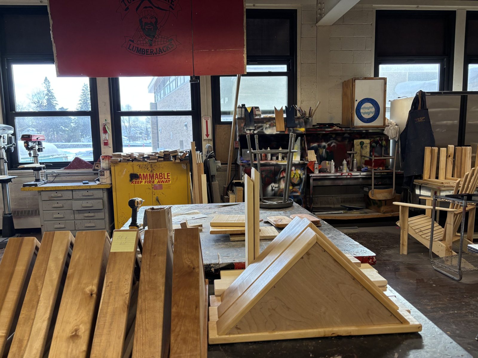 Student-built wood projects on a bench